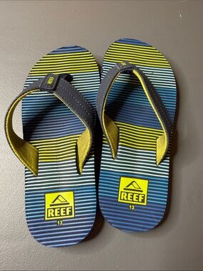 Kid’s Reef Blue & Yellow Striped Flip Flops. Size: 13